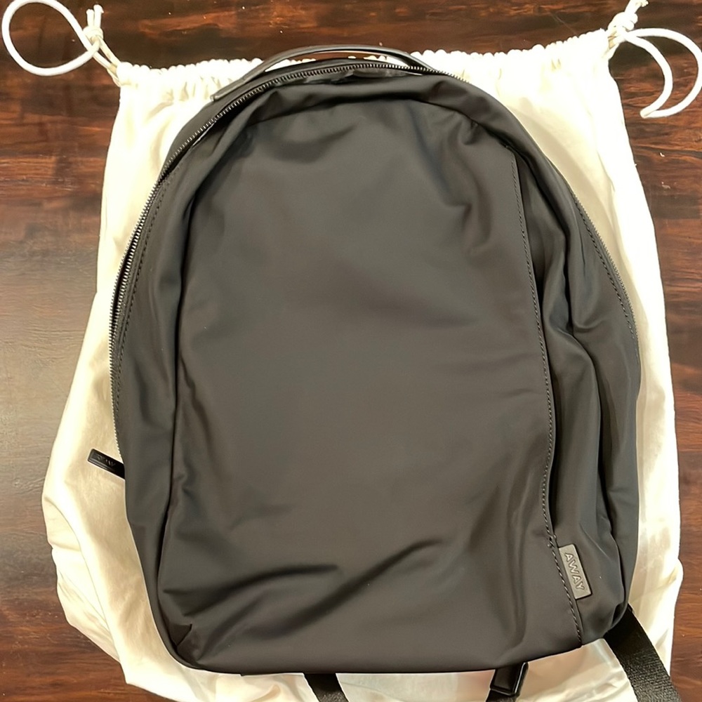 AWAY daypack used once. Excellent condition. Black with gray interior.